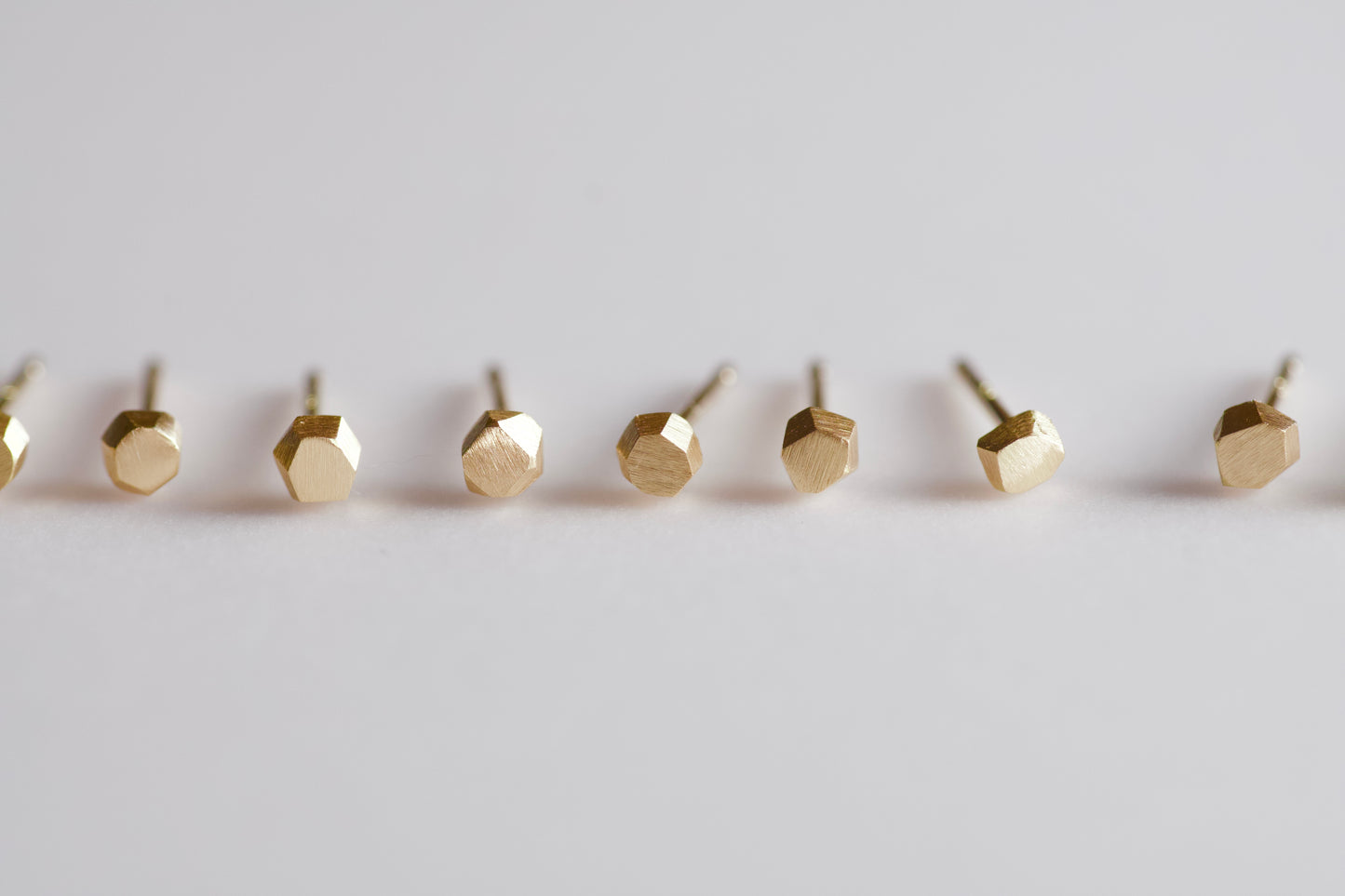 18k gold pebble earrings / one
