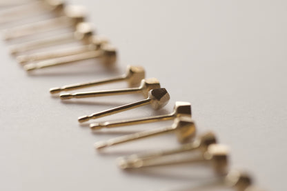 18k gold pebble earrings / one
