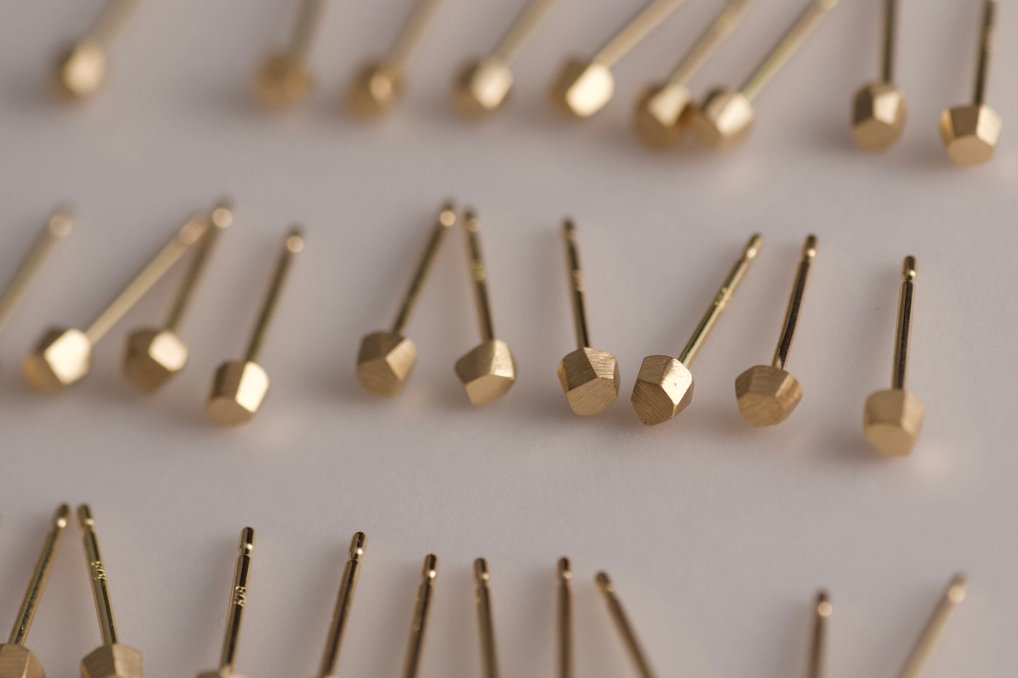 18k gold pebble earrings / one